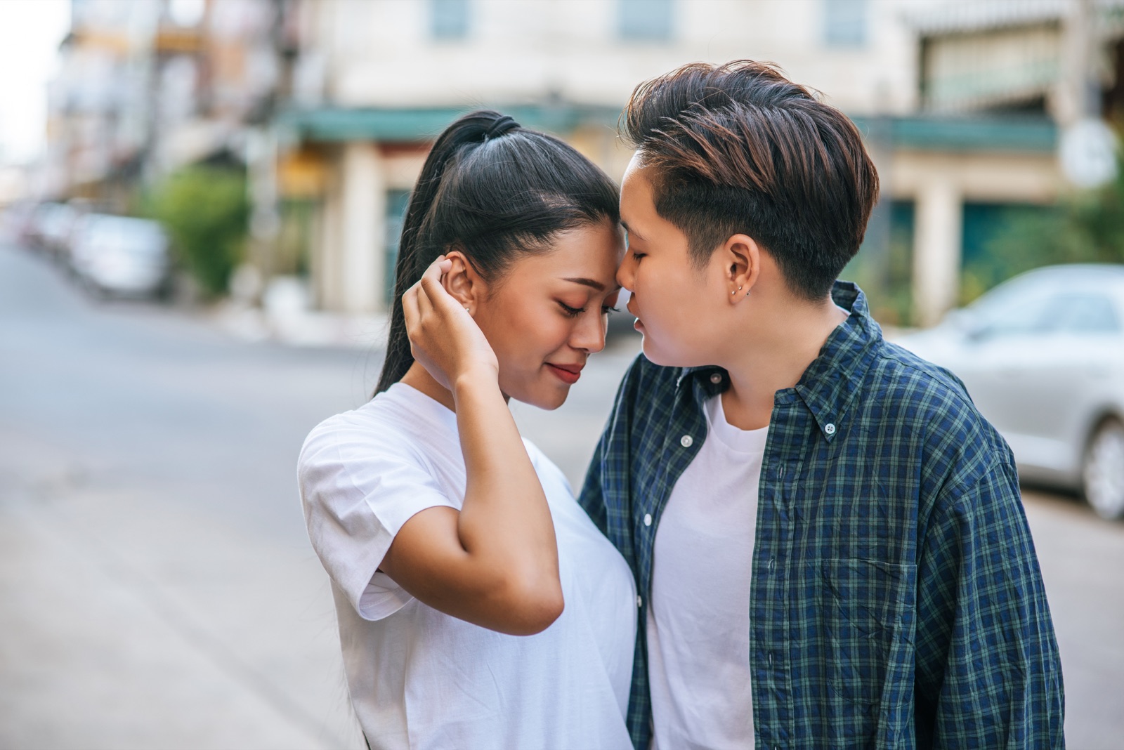 A couple resting their foreheads together
